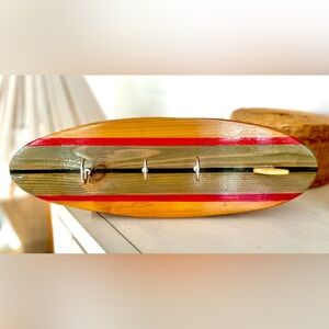 Surfboard shaped cedar key chain holders